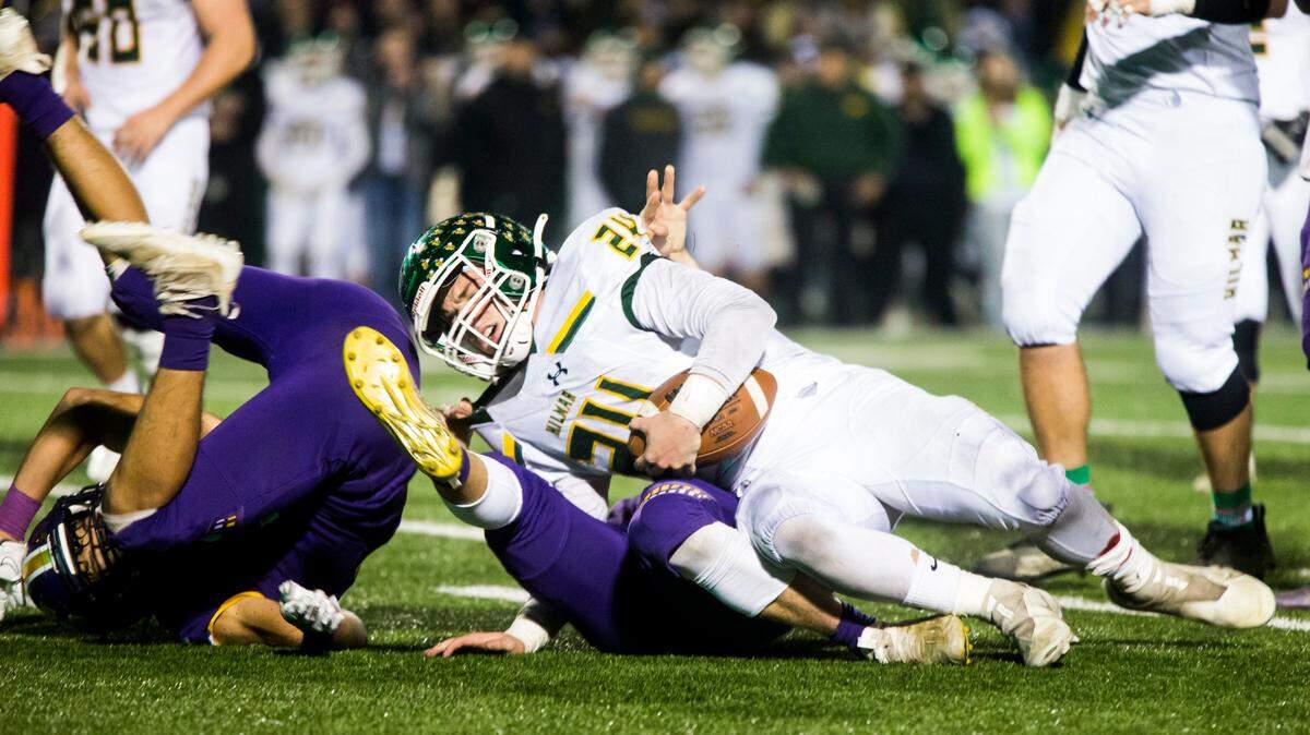 Jason Pimentel, 24, gets taken down by the defense from Escalon High. Escalon High School took on Hilmar High football during the 2021 CIF Sac-Joaquin Football Playoffs - Division V at Saint Mary’s High School in Stockton, Ca. Escalon came out on top as the champions with a 20-13 win over Hilmar.