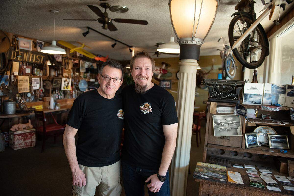 Eddie Gibson, left, has sold his burger joint to Robert Wilson, right, who will take over operation of Fast Eddie’s Meal-On-A-Bun on Tully Road in Modesto, Calif., on Wednesday, Feb. 2, 2022.