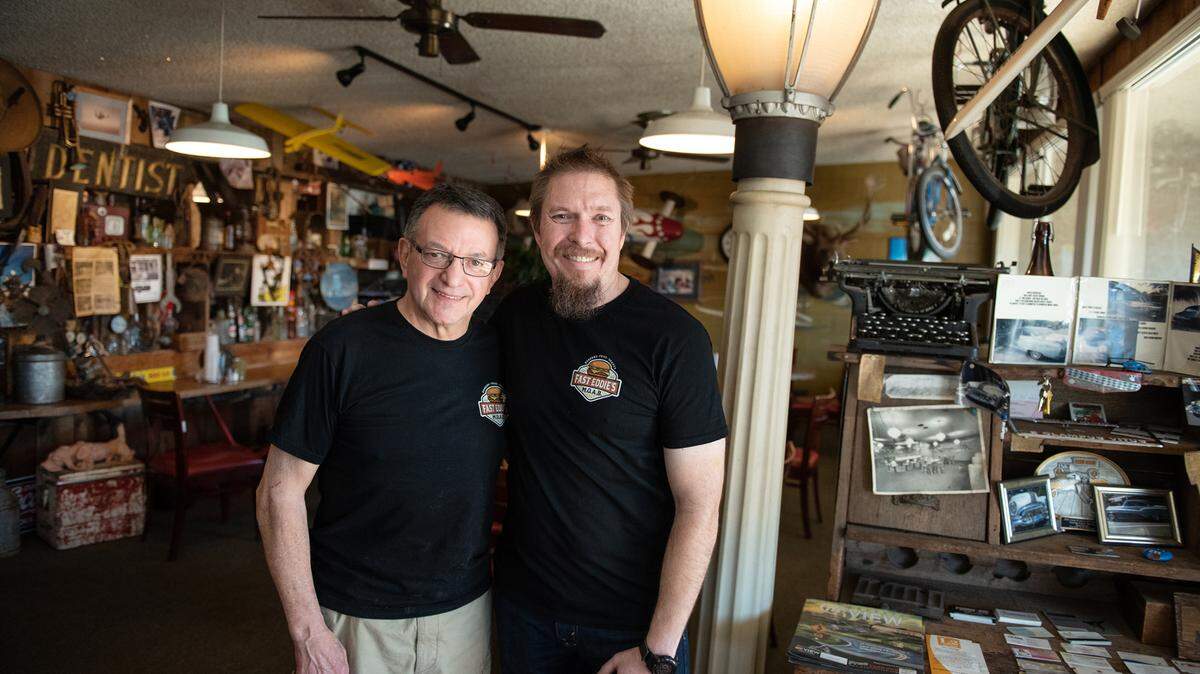 Eddie Gibson, left, has sold his burger joint to Robert Wilson, right, who’s taken over operation of Fast Eddie’s Meal-On-A-Bun on Tully Road in Modesto, Calif., on Wednesday, Feb. 2, 2022.