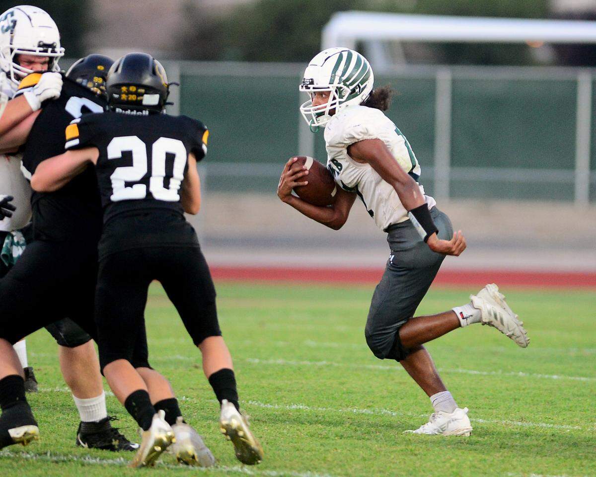 Central Valley running back Darrius Jackson follows his blockers during a game between Hughson High School and Central Valley High School at Hughson High School in Hughson California on August 25, 2023.