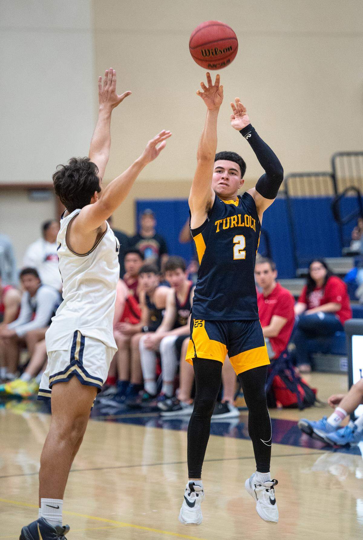Turlock’s Daniel Malagon launches a three-point shot as Central Catholic’s Julian Kuper defends during the Six-County Senior All-Star Basketball Game at Gregori High School in Salida, Friday, May 6, 2022.