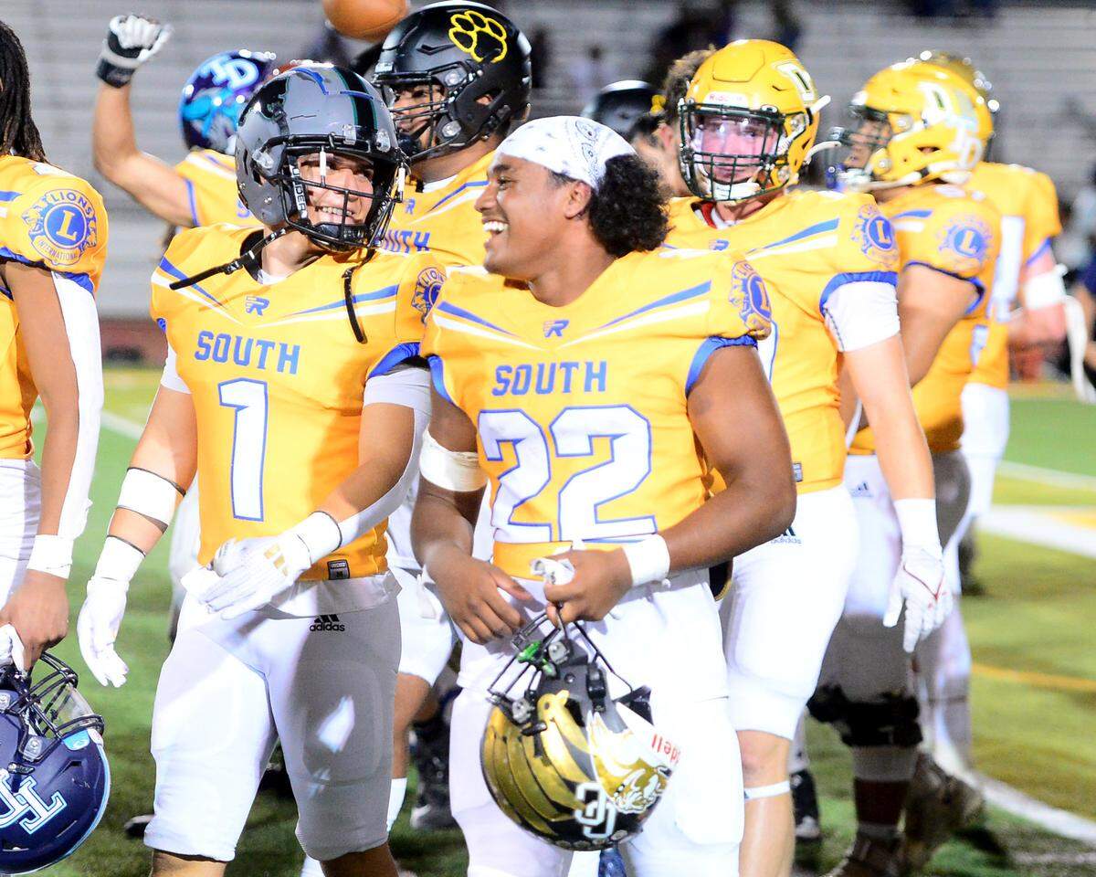 Enochs running back Aiden Muhammad (22) and Pitman’s Matthew Burciaga (1) smile after winning the 2024 Lions All-Star High School Football game at Tracy High School in Tracy, Calif. on June 22, 2024.