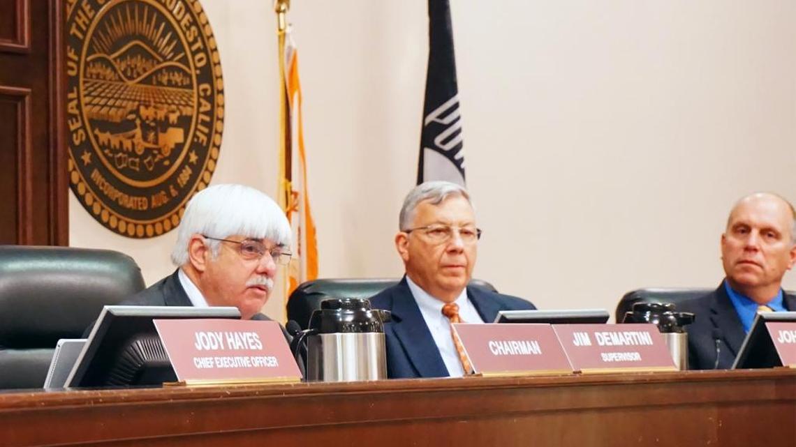Supervisor Jim DeMartini (left) gives the State of the County address Tuesday morning February 6, 2018 at the beginning of the Board of Supervisors meeting in the basement chambers of Tenth Street Place in downtown Modesto, Calif. Also pictured is John P. Doering, county counsel and supervisor Vito Chiesa (right).