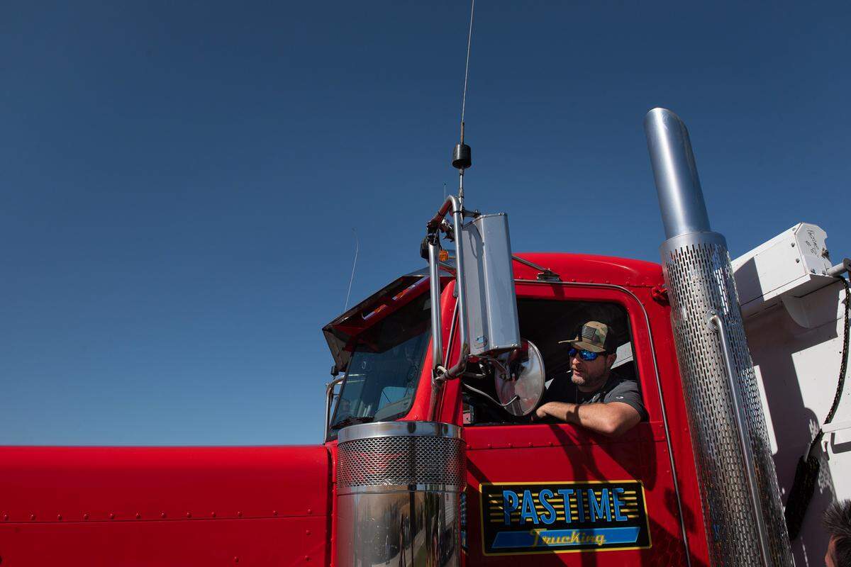 Truck driver Michael Bousquet pulls out of the truck wash in August, 2022.