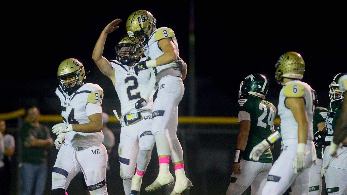 Central Catholic players celebrate with Tyler Jacklich after scoring a touchdown during a game between Central Catholic High School and Manteca High School in Manteca California on October 22, 2022. Central Catholic won the game 56-49.