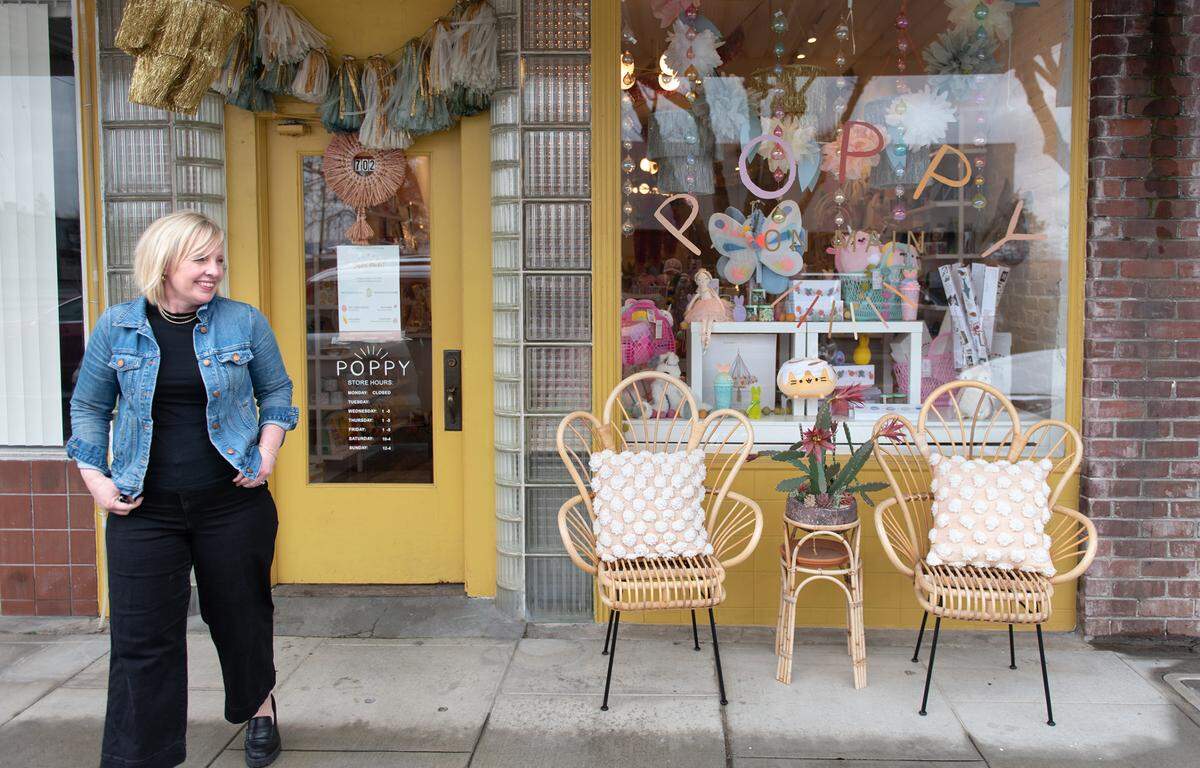 Owner Jamie Butler outside her children’s store Poppy on Main Street in Escalon, Calif., Tuesday, March 21, 2023.