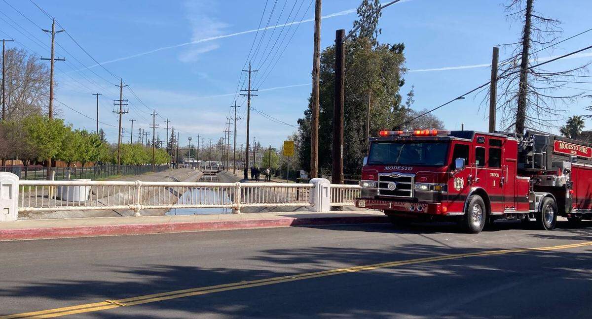 Modesto Police and Fire Departments investigate a body found in the Root Lateral Canal, near Stoddard Avenue on March 27, 2023.