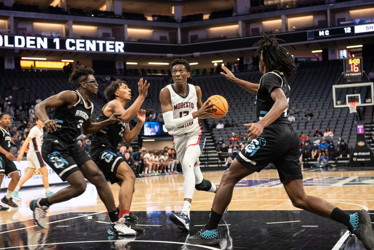 Modesto Christian’s Prince Oseya drives the to basket during the Sac-Joaquin Section Division 1 boys basketball championship game with Sheldon at the Golden 1 Center in Sacramento, Calif., on Saturday, Feb. 26, 2022. Modesto Christian won the game 52-42.