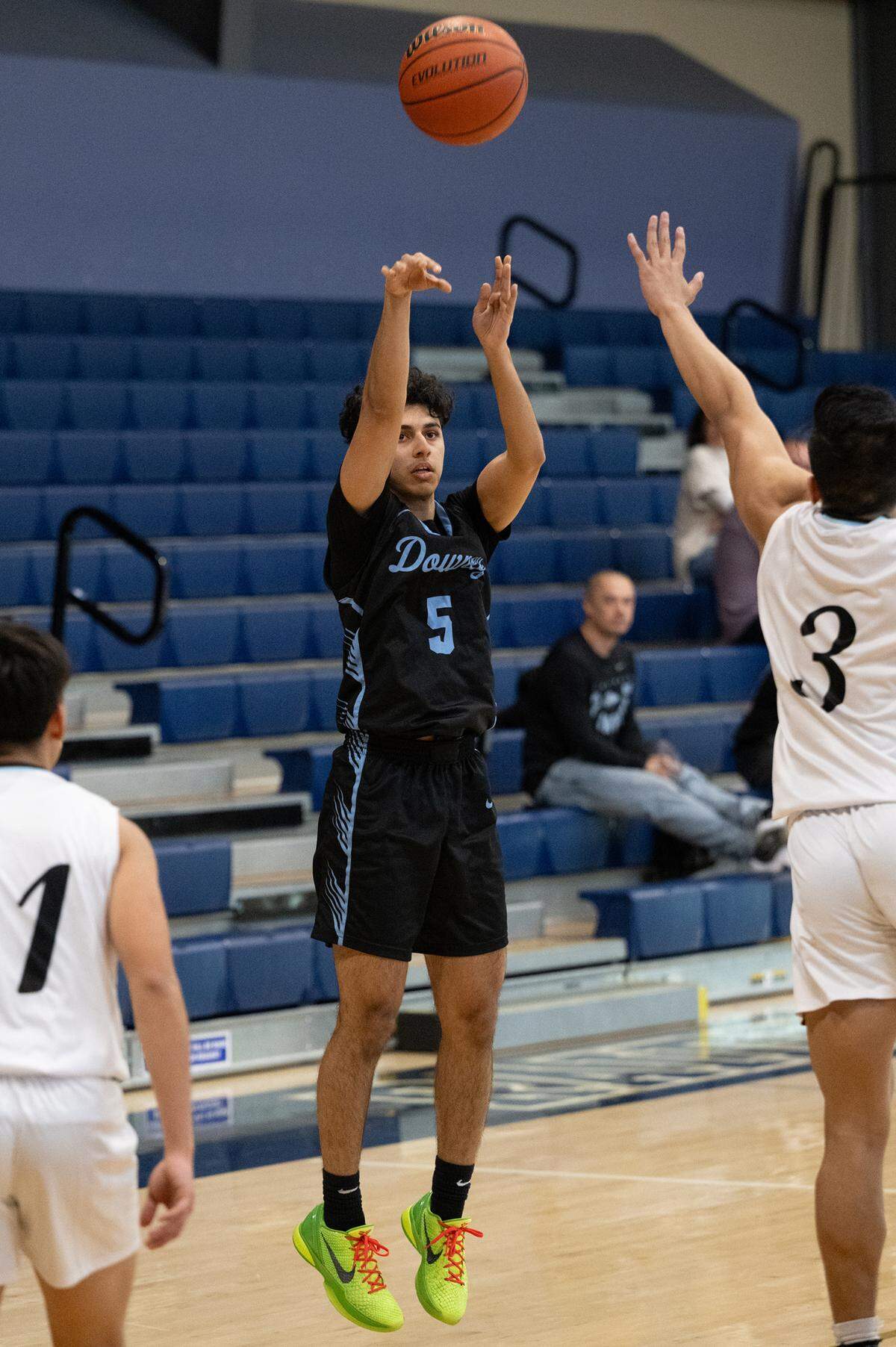 Downey’s Sumer Pannu shoots a three-point basket during the Mark Gallo Invitational Basketball Tournament game with El Capitan at Central Catholic High School in Modesto, Calif., Friday, Dec. 8, 2023.