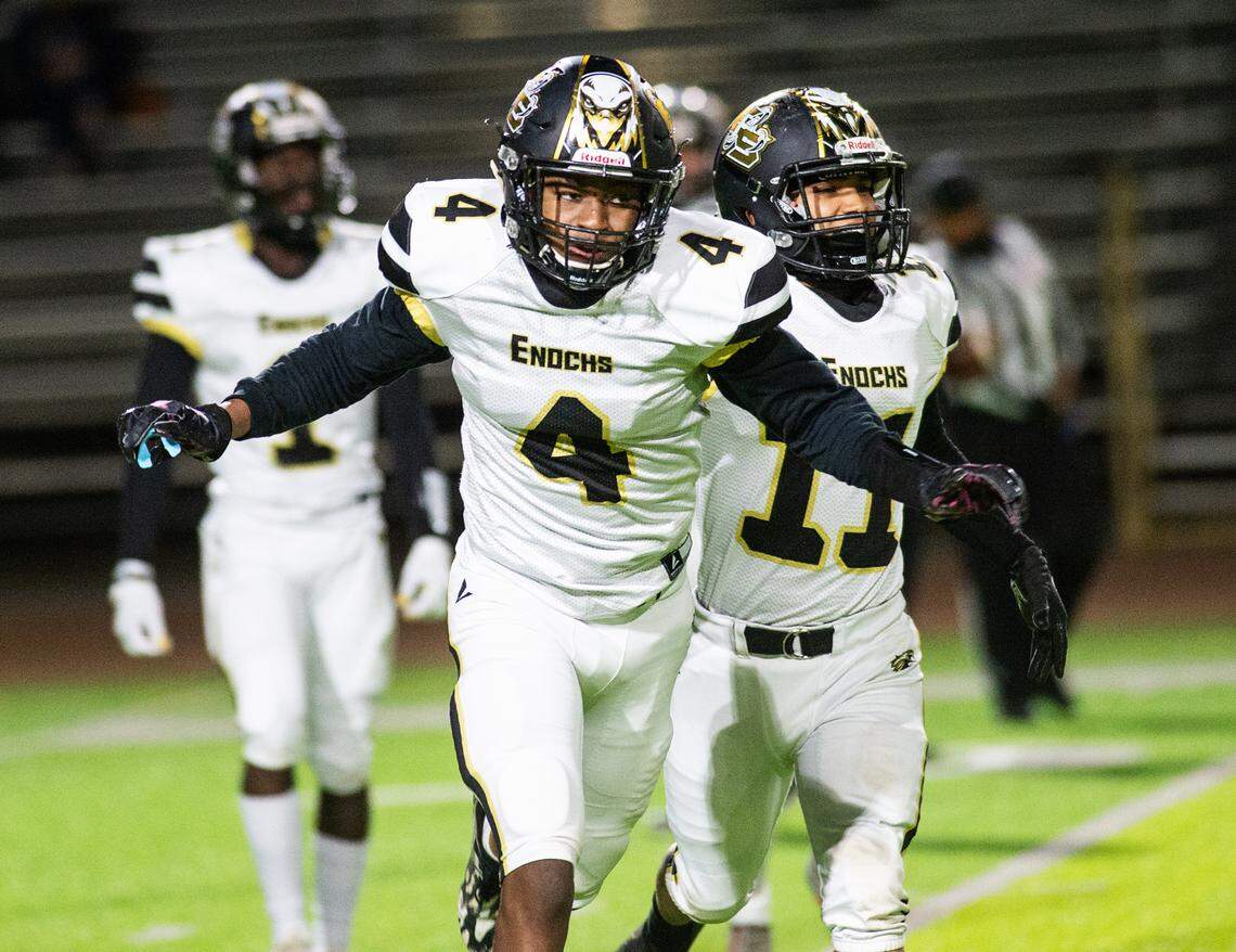 Enochs’ Kola Babalola leaves the field after making an interception during the Central California Athletic League game with Downey at Downey High School in Modesto, Calif., on Friday, March 26, 2021.