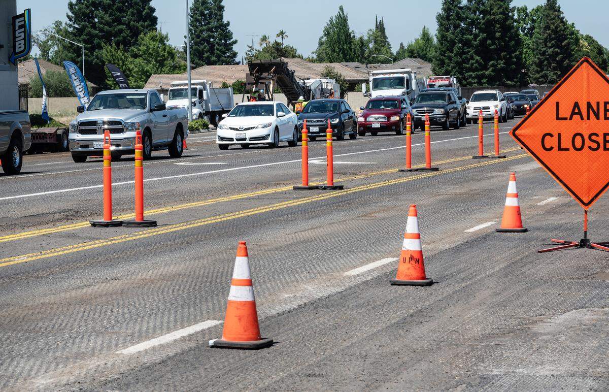 Roadway resurfacing will cause traffic to be reduced to one lane on Briggsmore Avenue in Modesto, Calif., Wednesday, June 21, 2023. The resurfacing project should take two days.