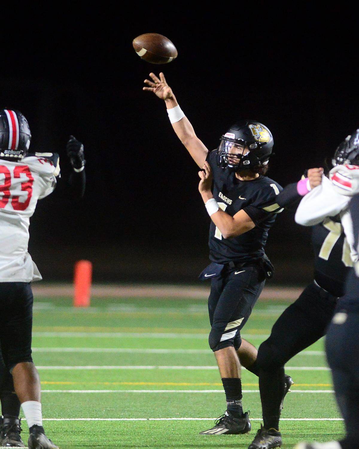 Enochs High quarterback Adam Ammar throws a short pass during a game against Modesto at Johansen High School in Modesto, Calif., on Oct. 28, 2022.