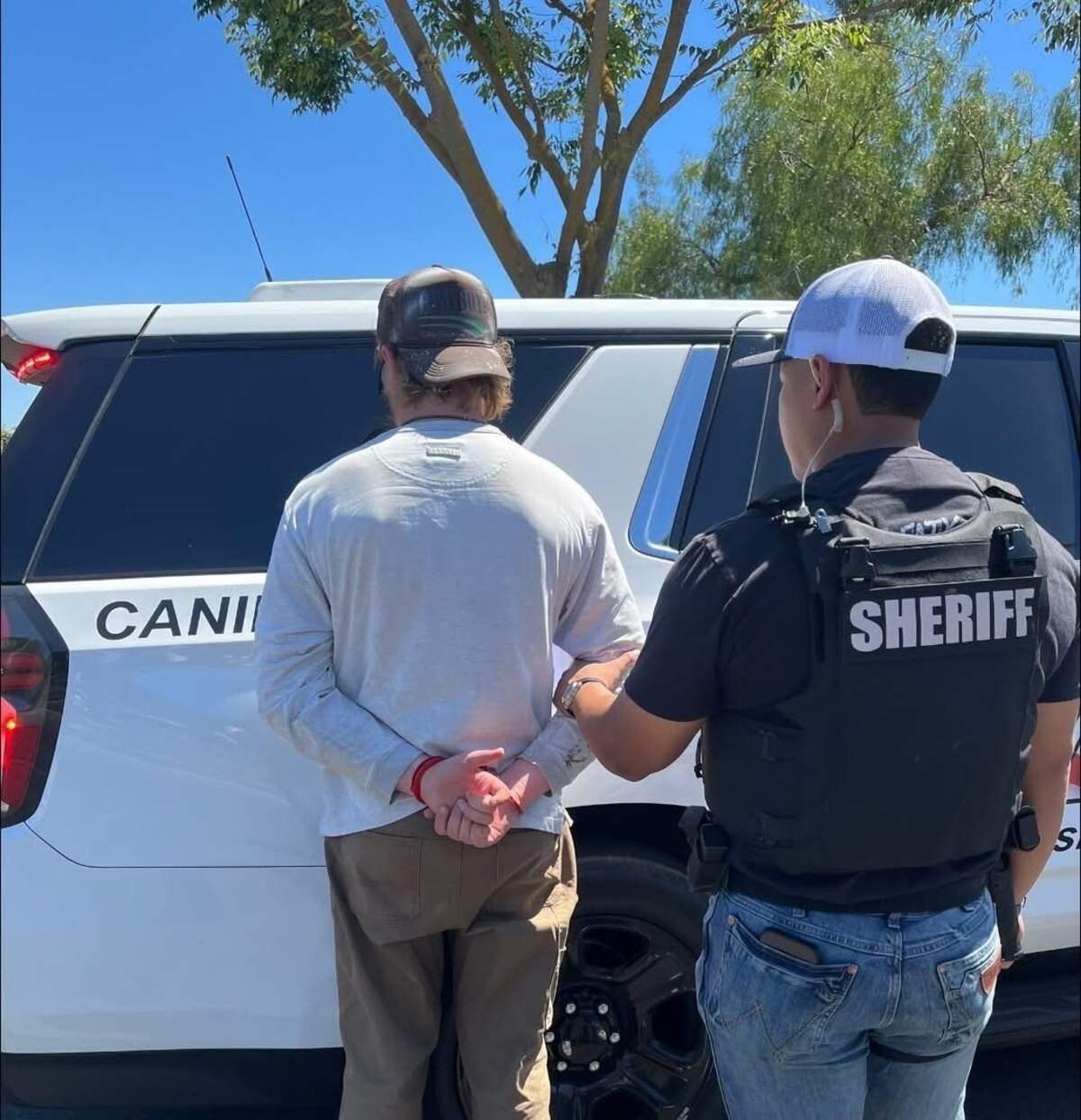 Phillip Abraham Daniel Capeder, 32, of Oakdale, is taken into custody by a Patterson Police Services detective following an investigation into allegations that he arranged to meet a person he believed was a minor for the purpose of engaging in sexual activity.