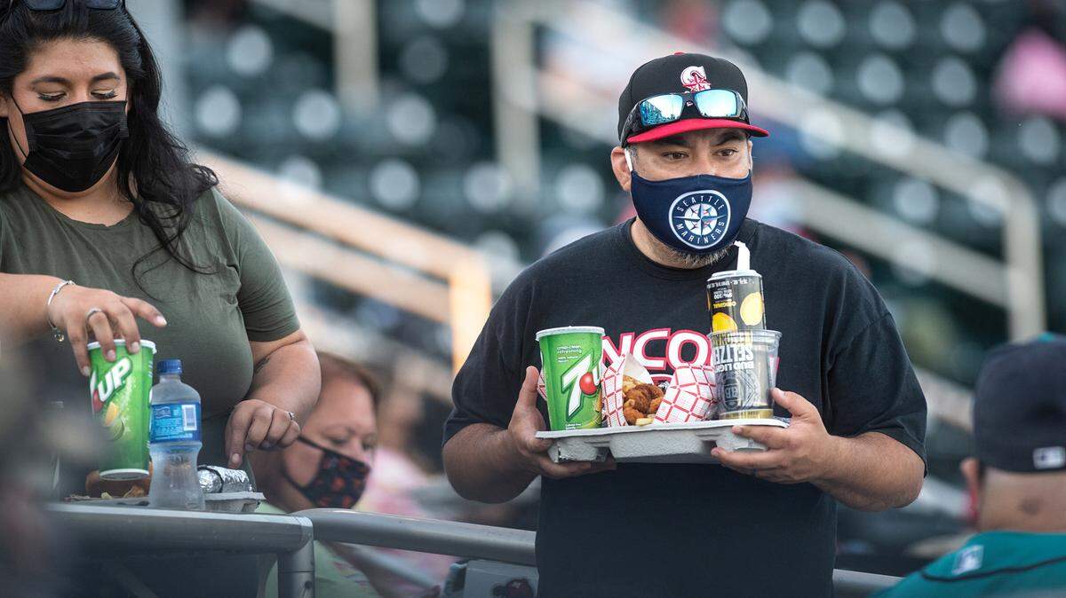 In Stanislaus County and the rest of the state Tuesday, capacity limits on businesses will end and people fully vaccinated against COVID-19 can stop wearing masks indoors and at crowded outdoor events. Here, baseball fans attend the Modesto Nuts opening day game with the Stockton Ports at John Thurman Field in Modesto, Calif., on Tuesday, May 4, 2021.