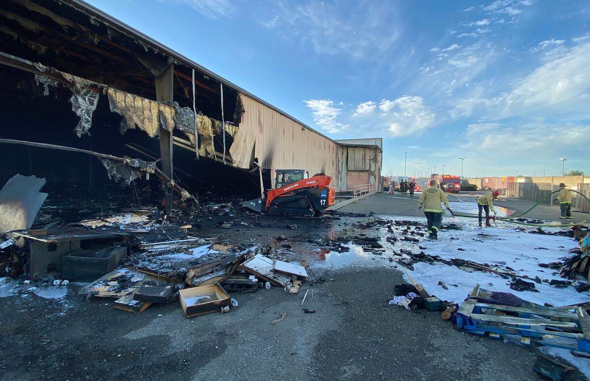 Modesto firefighters mop up from Thursday’s fire at The Salvation Army Family Thrift Store and Donation Center on north McHenry Avenue in Modesto. The fire was in the warehouse and its cause is under investigation.