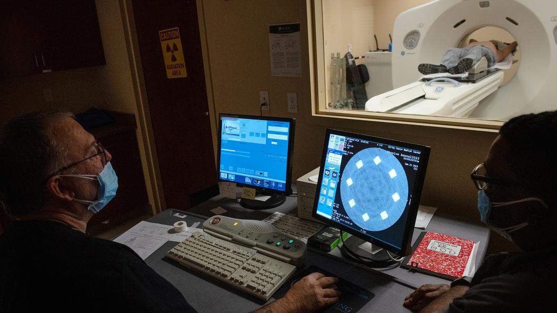 Radiation technicians Bat Jones (cq), left, and Robert Carroll, right, scan a patient using computerized tomography (CT) at the Valley Cancer Medical Center in Manteca, Calif., Wednesday, Jan. 23, 2023.