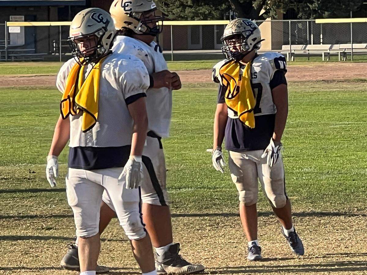 Central Catholic’s Benny Padilla and other scout team members wear yellow mesh jerseys at practice as the Raiders prepare for a game against Manteca.