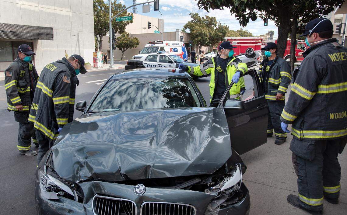 Modesto Fire tend to a traffic collision on J Street in downtown Modesto, Calif., Friday, Aug. 14, 2020.