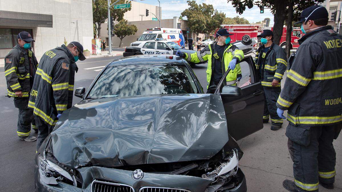 Modesto Fire tend to a traffic collision on J Street in downtown Modesto, Calif., Friday, Aug. 14, 2020.