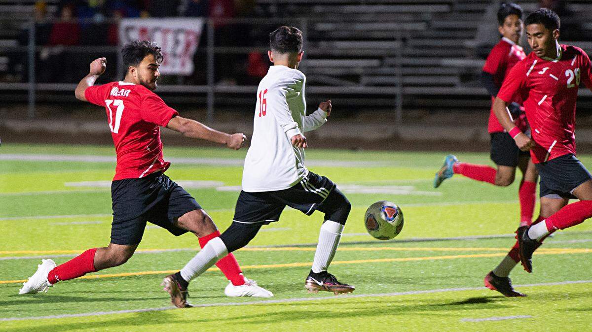 Modesto’s Alexis Luna Alvarez scores a goal past Lincoln’s Luis Ochoa during the first round Division 1 Sac-Joaquin Section Playoff game at Downey High School in Modesto, Calif., Tuesday, Feb. 14, 2023. Modesto won the game 3-2.