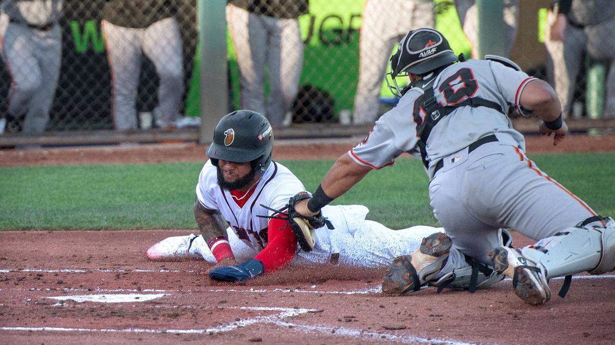 San Jose catcher Juan Perez tags out Modesto’s Ricardo Cova at the plate during the California League game at John Thurman Field in Modesto, Wednesday, June 18, 2025. The Giants clinched the California League North Division first half championship with a 5-2 victory over the Nuts.