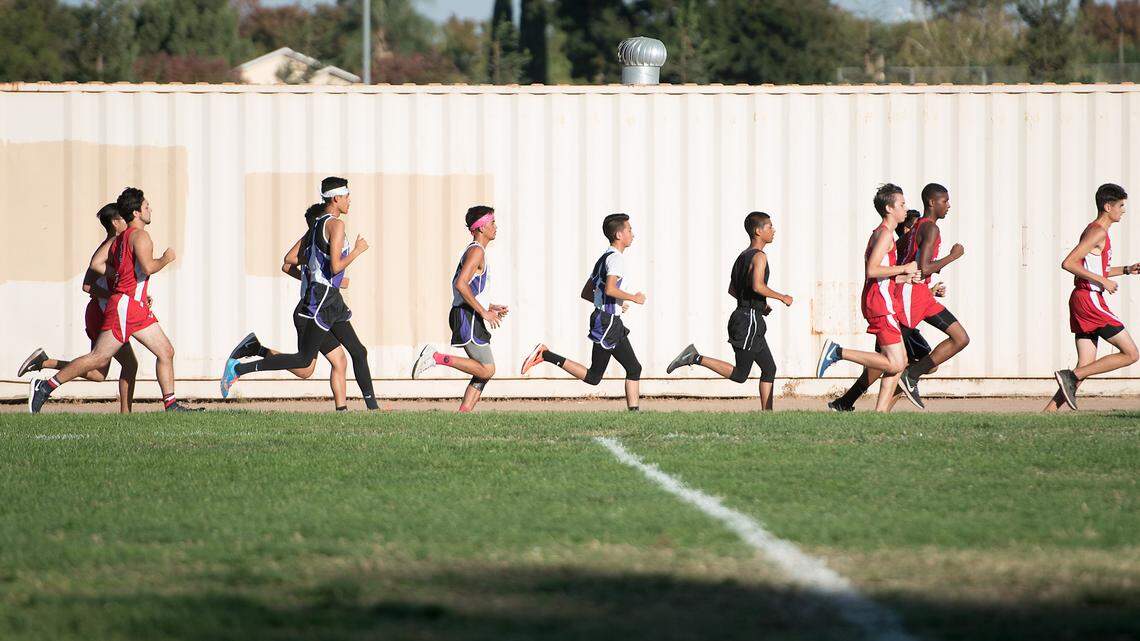 Pacheco and Beyer runners start the cross country race at Beyer Park in Modesto, Calif., on Wednesday, Oct. 10, 2018.