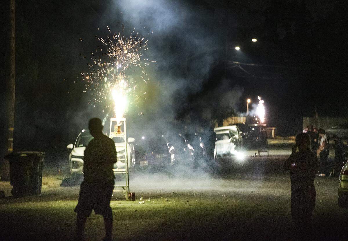 People shoot off legal fireworks in Modesto Calif., Thursday, July 4, 2019.