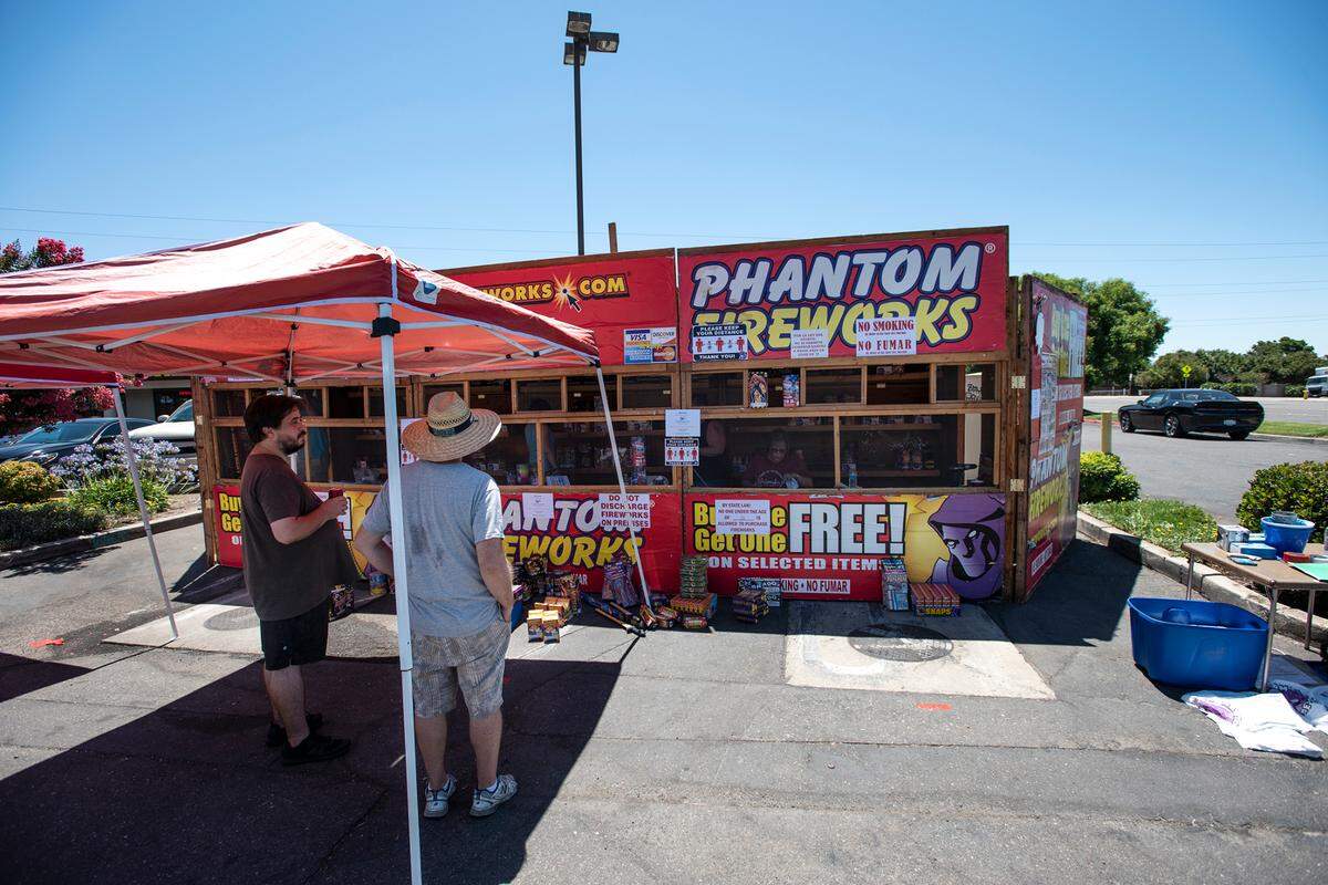 Members of the Modesto Foursquare Church set up a fireworks booth at a shopping center on Prescott Road and Stanford Avenue in Modesto, Calif., on Tuesday, June 30, 2020.