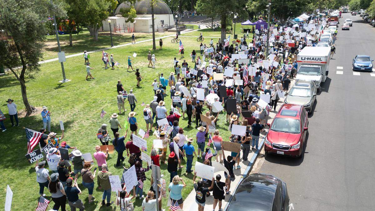 Protesters march in Graceada Park during the “No Kings” protest in Modesto, Saturday, June 14, 2025.