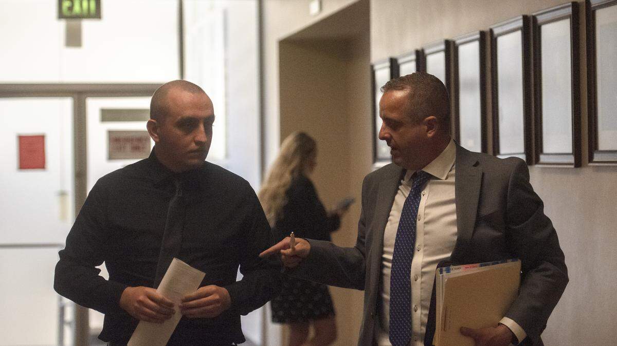 Former Los Angeles County sheriff’s deputy Darin Lee Van Arsdale II, left, walks through the hallway of Stanislaus County Superior Court alongside defense attorney Ryan Roth following a hearing Thursday in Modesto. Van Arsdale’s preliminary hearing was continued to Aug. 14 as prosecutors referenced possible conduct in Los Angeles County.