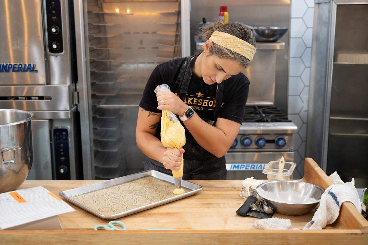 The Bakeshop owner Ashley Olson makes forms pastries in Modesto, Calif., Thursday, Oct. 12, 2023.