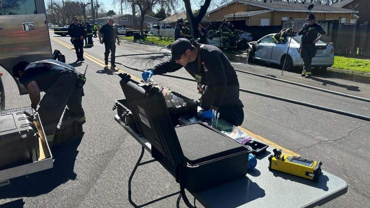 At the scene of a fatal crash Tuesday afternoon in downtown Modesto and involving an electric vehicle, hazmat personnel isolated the area and tested the residual runoff water to ensure it was not contaminated.