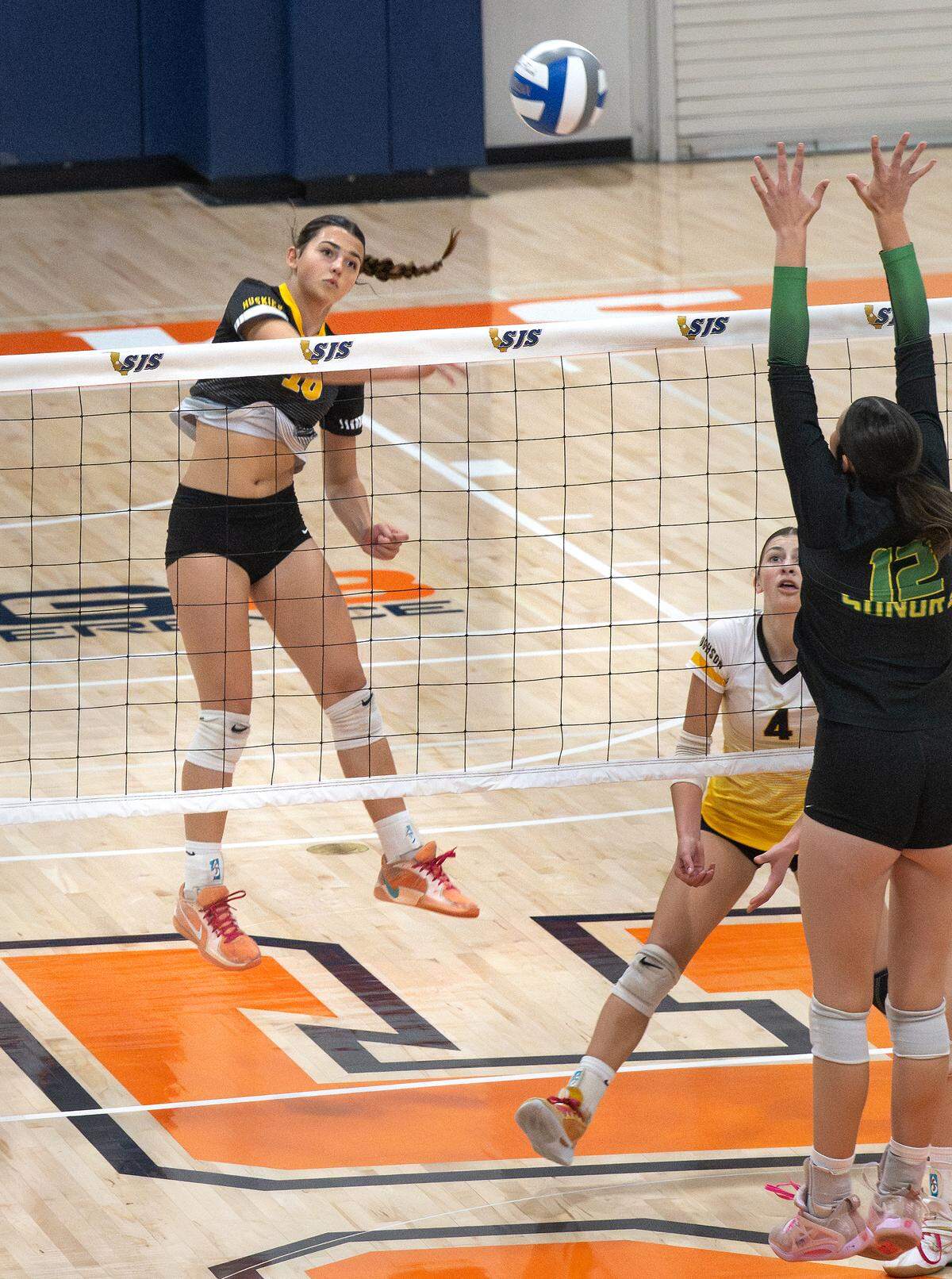 Hughson’s Olivia Piazza spikes the ball during the Sac-Joaquin Section D4 volleyball championship match with Sonora at Cosumnes River College in Sacramento, Saturday, Nov. 8, 2025. 