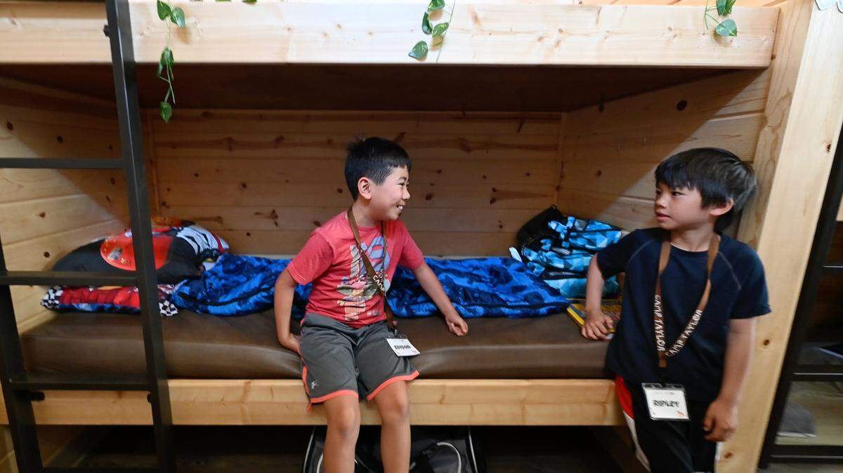 Edison Wu ,10, left, and fellow camper Ripley Shair, 7, talk in their cabin at Camp Taylor in Grayson, Calif., Tuesday, June 11, 2024. Camp Taylor is a medically supervised summer camp for children with heart disease and their family members.