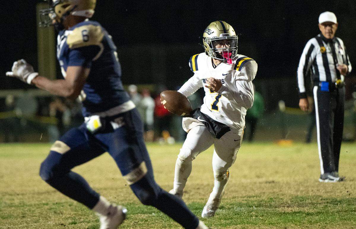 Turlock quarterback Scout Silva scrambles on a run during the Sac-Joaquin Section Division I playoff game with Central Catholic at Central Catholic High School in Modesto, Friday, Nov. 15, 2024.