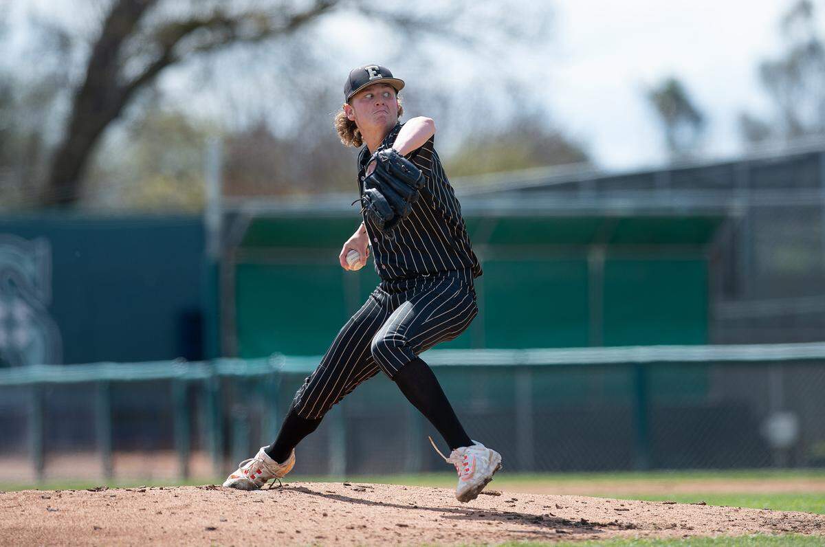 Enochs pitcher Kannon Sharpe delivers a pitch during a showcase game with Turlock at John Thurman Field in Modesto, Calif., Friday, March 31, 2023.