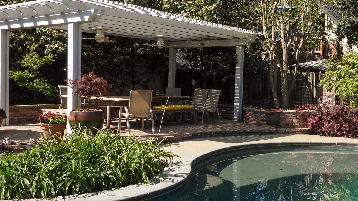A poolside pergola at one of the Magnolia Avenue homes on the Modesto Garden Club’s Spring Garden Tour.