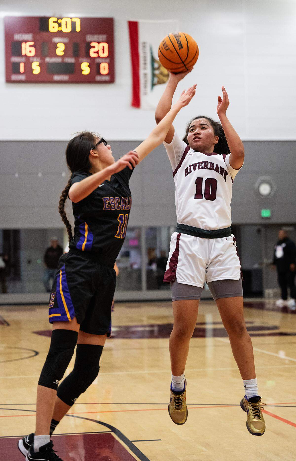 Riverbank’s Chancis Gamez shoots over Escalon’s Arianna Velasco during the Trans Valley League game at Riverbank High School in Riverbank, Calif.,Thursday, Jan. 4, 2024.
