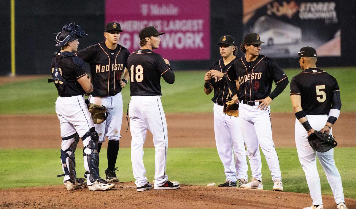 Modesto Nuts’ manager Zach Vincej, middle, makes a pitching change during the California League Championship game with Lake Elsinore at John Thurman Field in Modesto, Calif., Tuesday, Sept. 17, 2024. The Nuts struggled at the mound in 9-2 loss loss to the Storm.