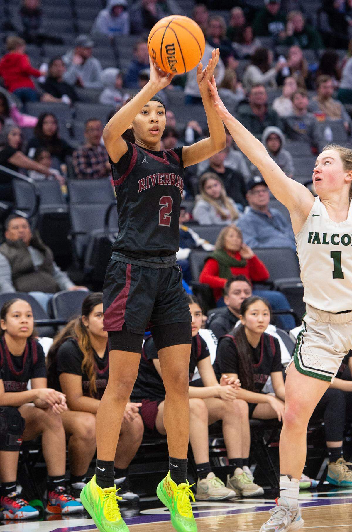 Riverbank’s Taylor Macias scores on a three-point shot as Colfax’s Gabriella Biittner defends during the Sac-Joaquin Section Division IV championship game at Golden 1 Center in Sacramento, Calif., Friday, Feb. 24, 2023.
