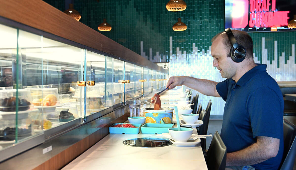 Justin Duguay eats lunch at Hawai’i Pot Shabu Shabu House in Modesto, Calif., Tuesday, May 14, 2024.