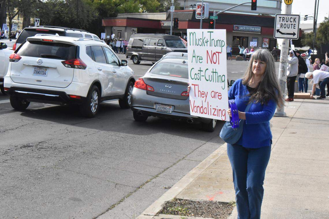 Susan Robinson of Modesto was among several hundred people on all corners at the Five Points intersection in downtown Modesto on Saturday, April 5, for a Hands Off rally and march. It was part of a nationwide day of action to declare ‘Hands off’ to President Donald Trump and Elon Musk.
