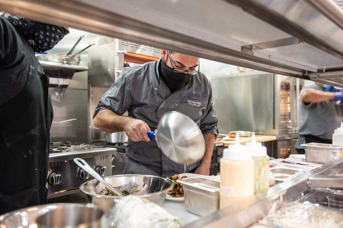 Chef Michael Ortiz prepares crispy brussel sprouts at Burly’s California Bistro in Modesto, Calif., on Tuesday, March 23, 2021.