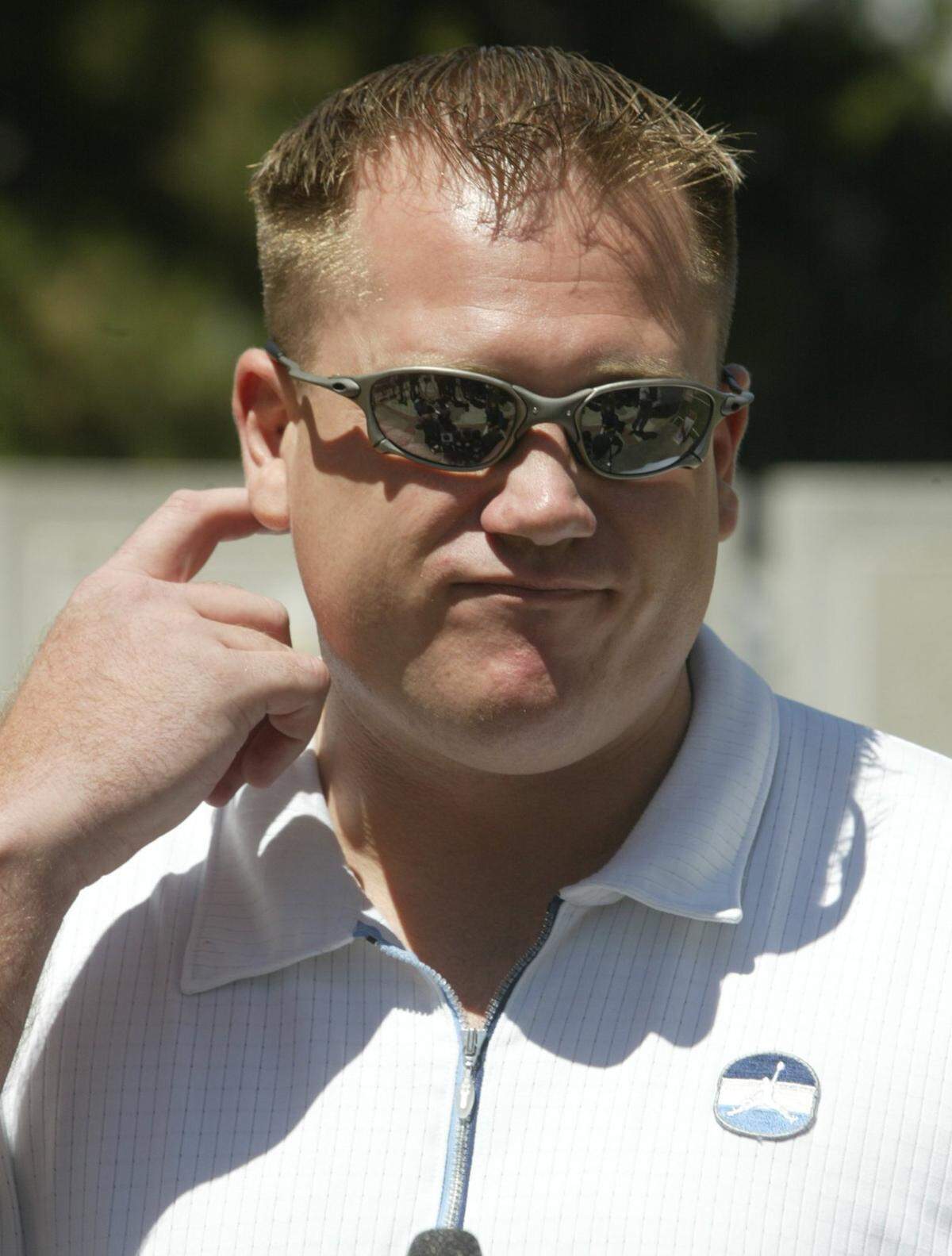 Justin Falconer, previously known to the world as Juror No. 5 in the Scott Peterson murder trial, speaks with the media after he was kicked off the jury Wednesday, June 23, 2004, in Redwood City, Calif. Scott Peterson is on trial for the murder of his wife Laci Peterson, and their unborn son. (AP Photo/ John Green, Pool)