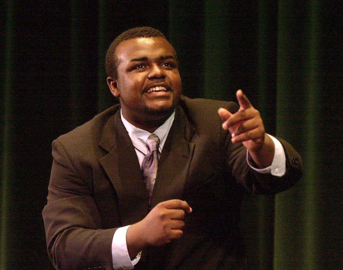 In this 2002 photo, Johansen speech student Don Lacey gives a dramatic presentation of “Bums” that left tears in the eyes of most in attendance.