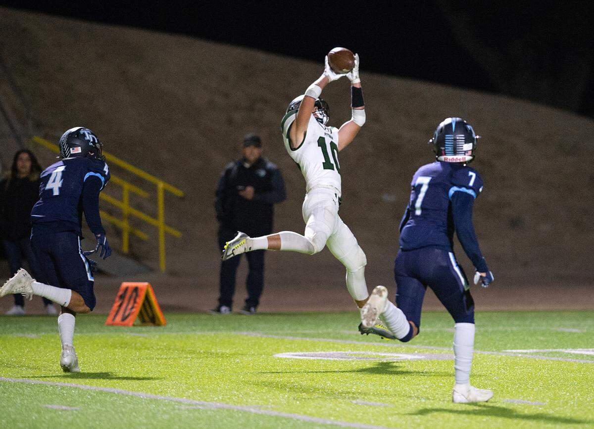 Pitman’s Dylan Freeman makes a touchdown grab during the Central California Athletic League game with Downey at Downey High School in Modesto, Calif., Friday, Oct. 28, 2022.