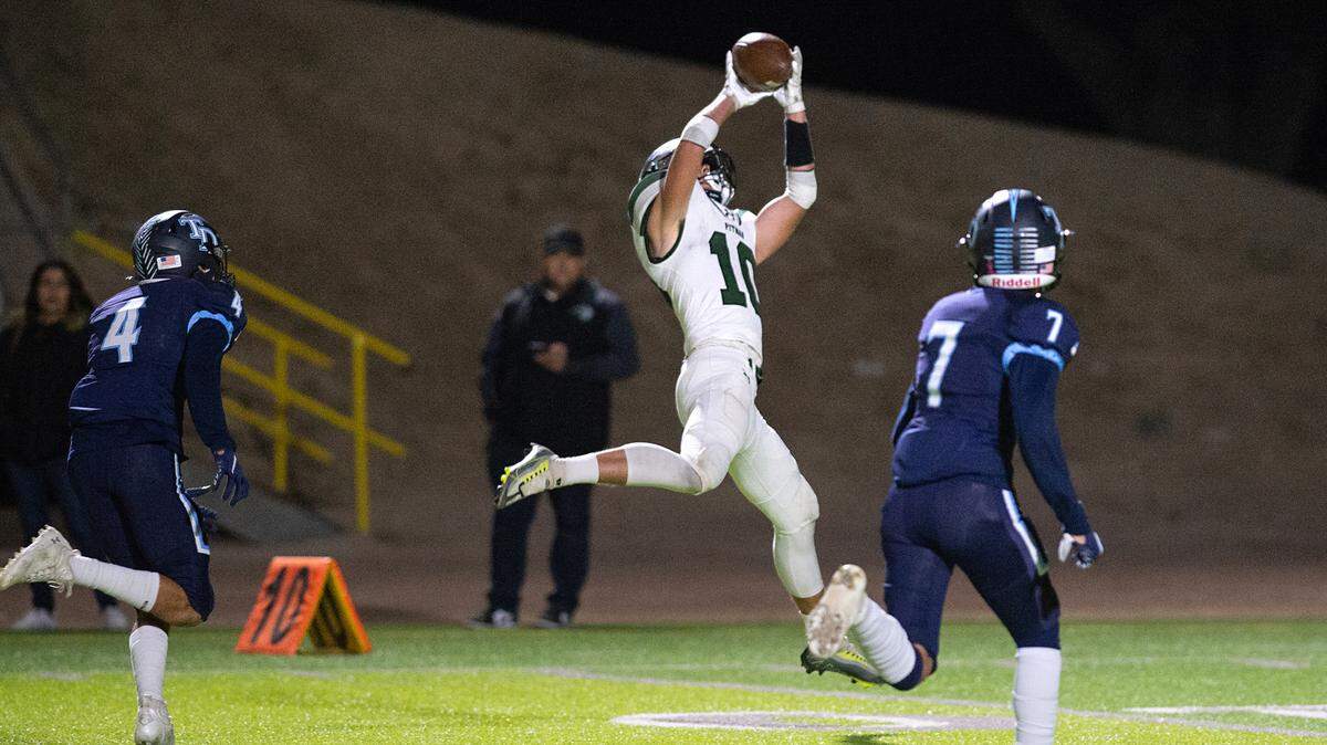 Pitman’s Dylan Freeman makes a touchdown grab during the Central California Athletic League game with Downey at Downey High School in Modesto, Calif., Friday, Oct. 28, 2022.