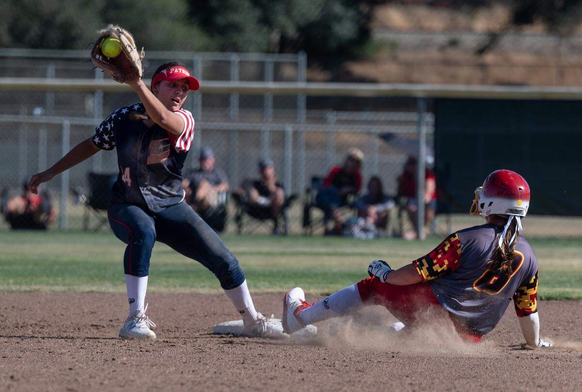 Oakdale’s Amanda Bricker (8) steals second base as Beyer’s Alison Robinson receives the throw during the first round playoff game at Oakdale High School in Oakdale, Calif., on Tuesday, May 17, 2022. Oakdale won the game 10-0.
