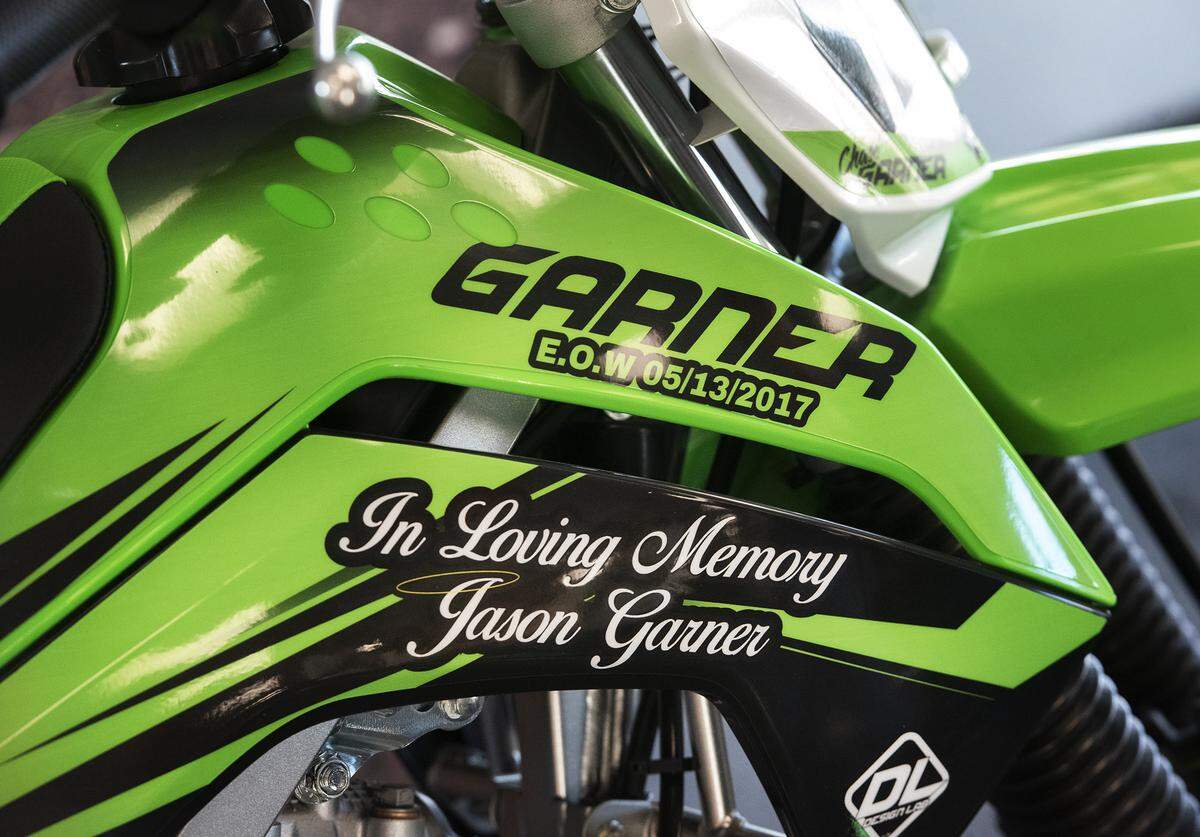 Chase Garner, 12, son of late Stanislaus Sheriff’s Deputy Jason Garner was surprised with a new motorized dirt bike. Local law enforcement officers, businesses and community members raised funds for the off-road motorcycle. Photographed at Honda Kawasaki KTM in Modesto, Calif., Saturday, Nov. 16, 2019.