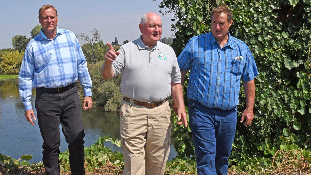 Congressman Jeff Denham (left) and US Secretary of Agriculture Sonny Perdue tour the Brichetto Ranch Tuesday morning, August 14, 2018 in Oakdale, Calif. John Brichetto is pictured at right.